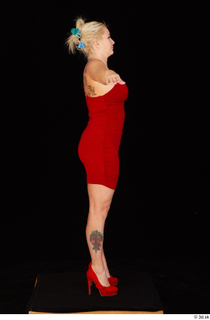 Jarushka Ross dressed red dress red high heels standing t…